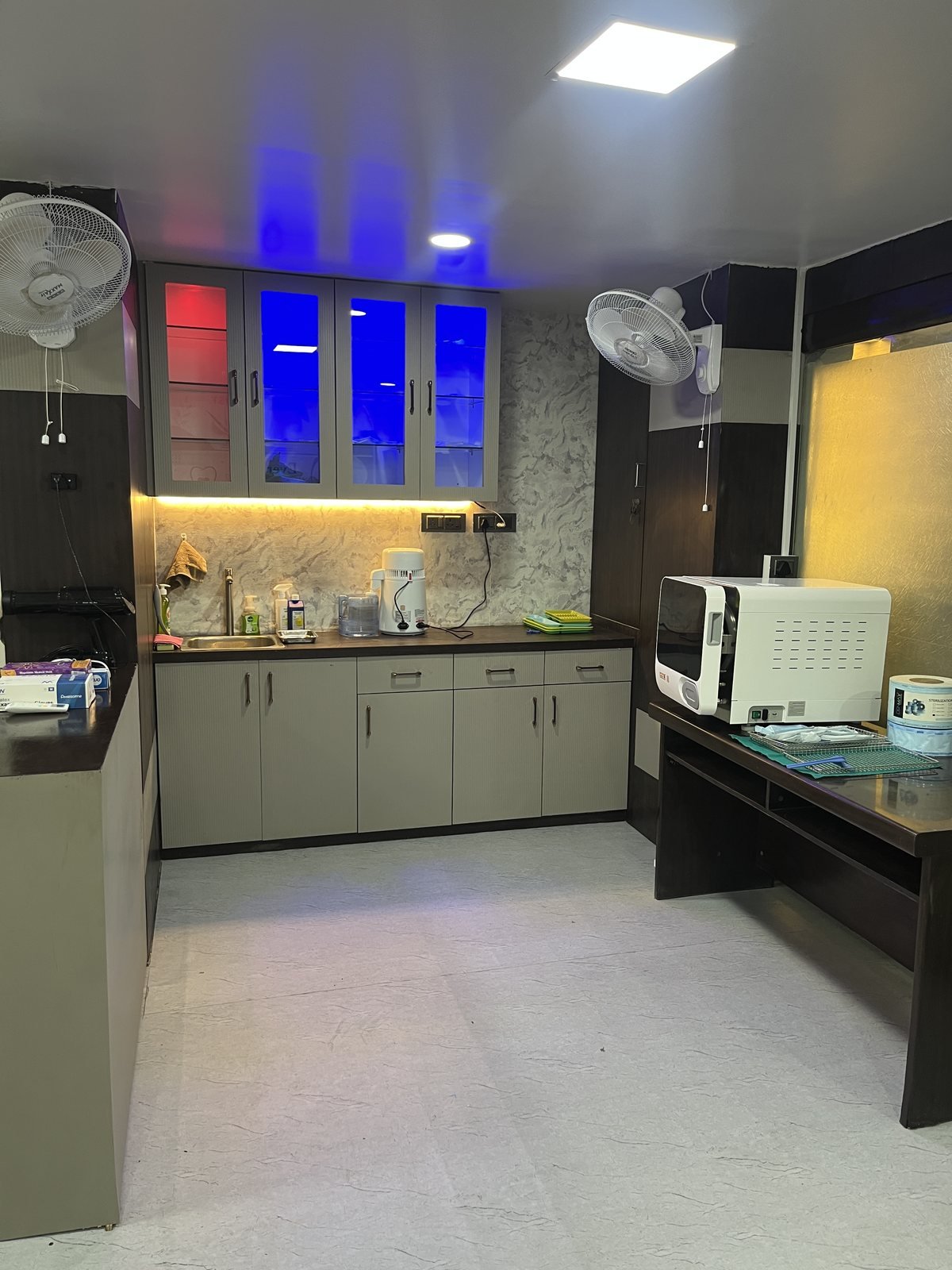 Separate sterilisation room with an autoclave and instrument preparation counter at White Oak Dental Studio, Ranchi