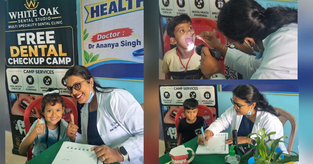 Dr. Ananya giving a thumbs-up with a smiling student at the White Oak free dental check-up camp, Sacred Child Academy, Kokar, Ranchi